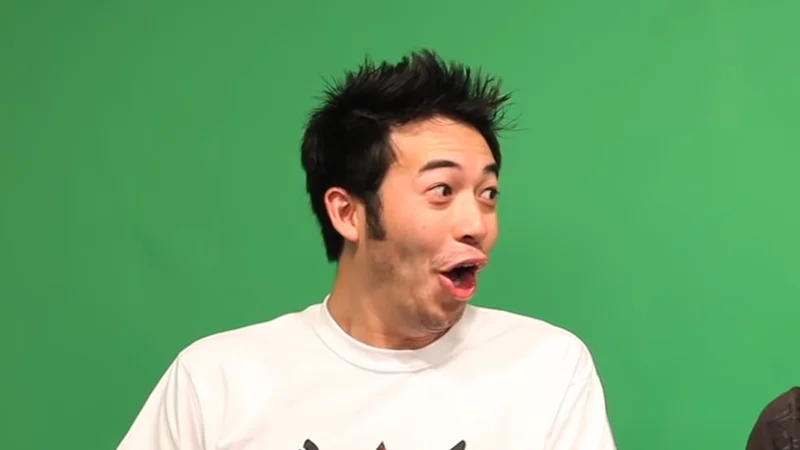 Pogchamp — Ryan Gootecks Gutierrez making a shocked, open-mouthed expression in front of a green screen