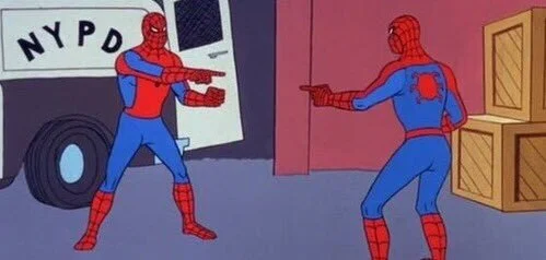 The canonical Pointing Spider-Man meme template from the 1967 animated series showing two identical Spider-Men in red and blue costumes pointing at each other.
