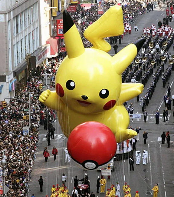 Pokémon — Yellow Pikachu-themed car with Pokeball wheels and Pokemon logo