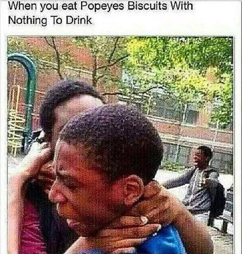 Meme about eating Popeyes biscuits with nothing to drink showing a chokehold reaction image