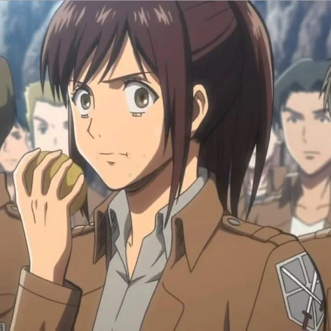 Potato Girl — Sasha Braus from Attack on Titan holding a bitten potato in her hand while wearing a cadet uniform.