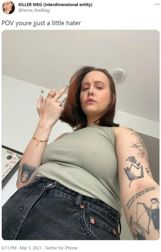 POV You're — A woman holding a cigarette and looking down with dismissive expression captioned 'POV youre just a little hater'.