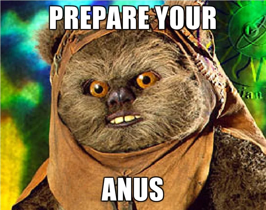 Close-up of an Ewok baring its teeth with the caption 'PREPARE YOUR ANUS' in white Impact font