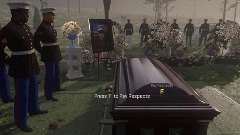 Press F to Pay Respects — The primary Call of Duty Advanced Warfare funeral cutscene showing soldiers at attention beside a draped casket in cemetery setting.
