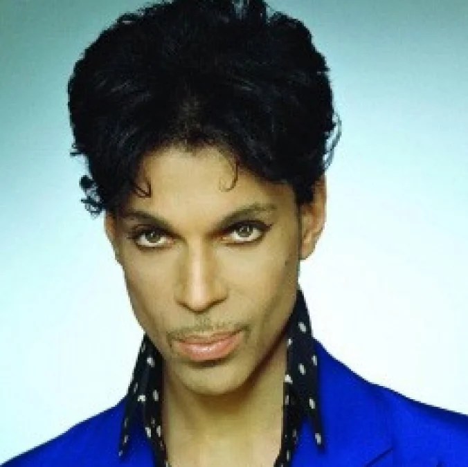 Portrait of Prince in a blue jacket with polka-dot collar