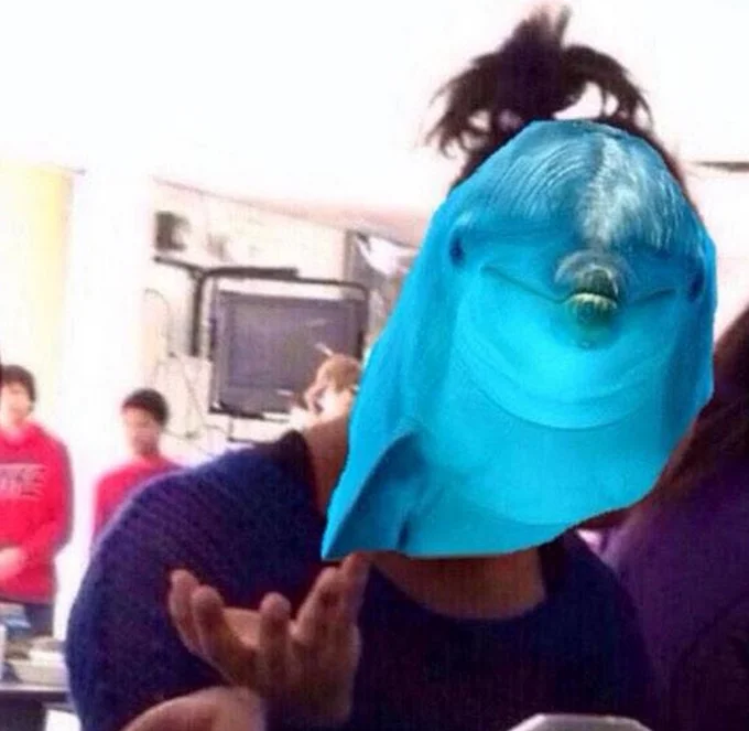 PSAT — Person in classroom with dolphin head photoshopped over their face