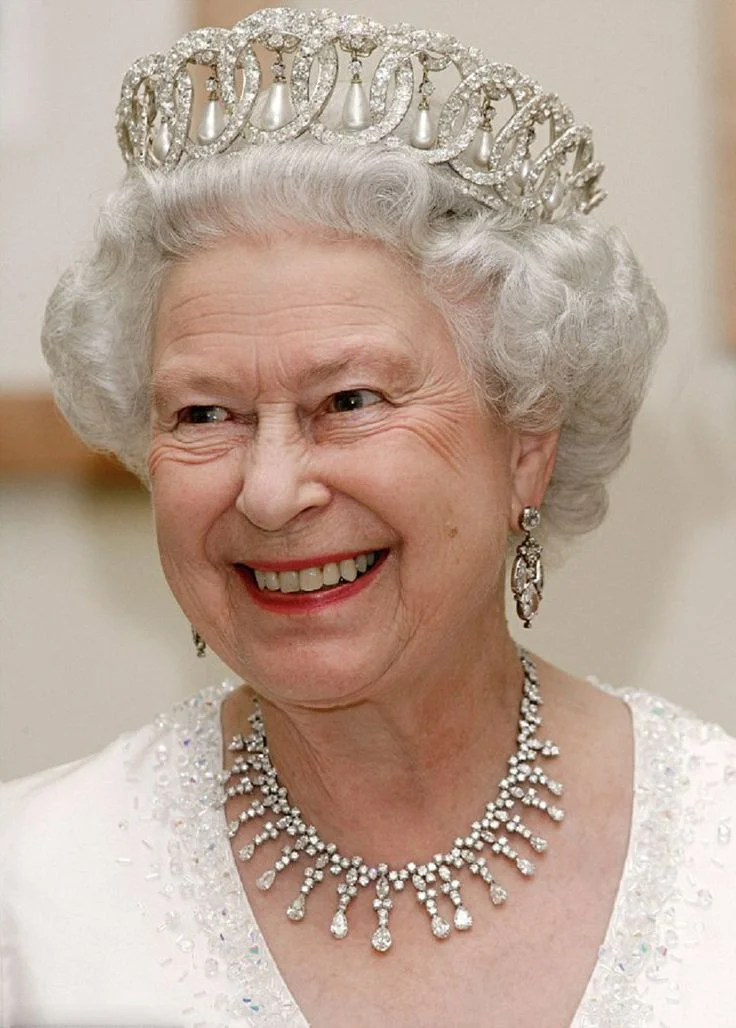 Queen Elizabeth II smiling in diamond tiara and necklace