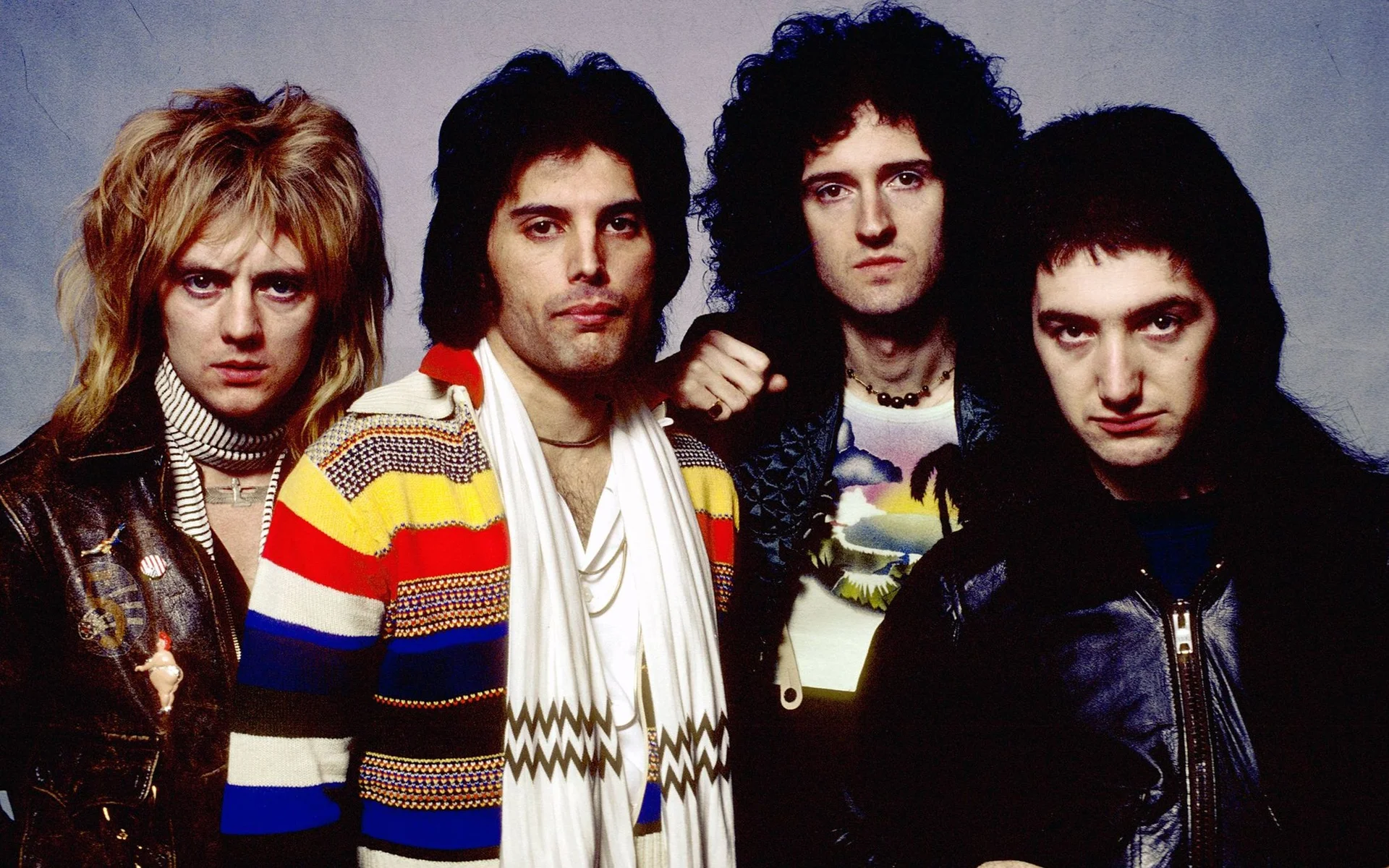 Group portrait of the four members of the rock band Queen