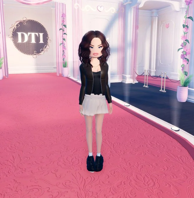Rachel Sennott's "Fatima" — Roblox Dress to Impress avatar styled as Rachel Sennott 'Fatima' with brown hair, black leather jacket, white skirt.