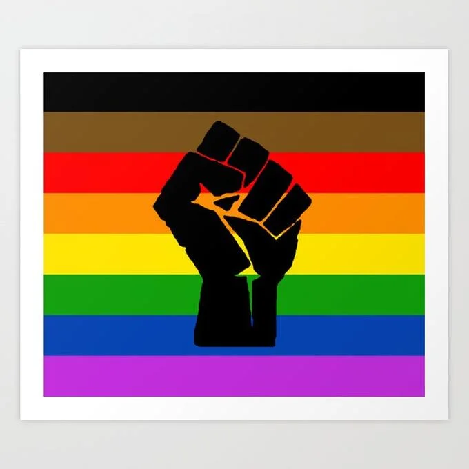 A graphic art print showing a bold black raised fist silhouette centered over an inclusive Pride flag with rainbow stripes, black stripes, and brown stripes.