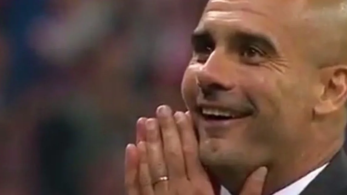 Reaction Images — Pep Guardiola smiling with hands clasped near his face in delight