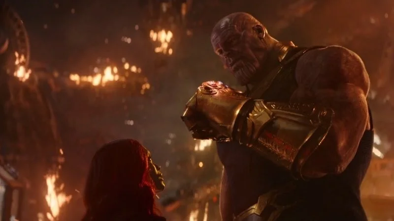Reality Can Be Whatever I Want — The definitive Thanos snap moment from Avengers: Infinity War with cinematic quality showing Thanos center-frame with glowing