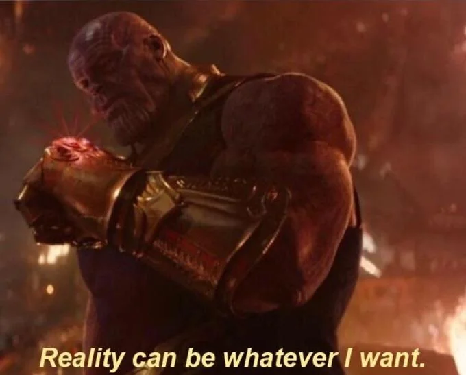 A clean uncluttered version of the Thanos meme showing the character mid-snap with fiery effects with 'Reality can be whatever I want' in yellow italic text.