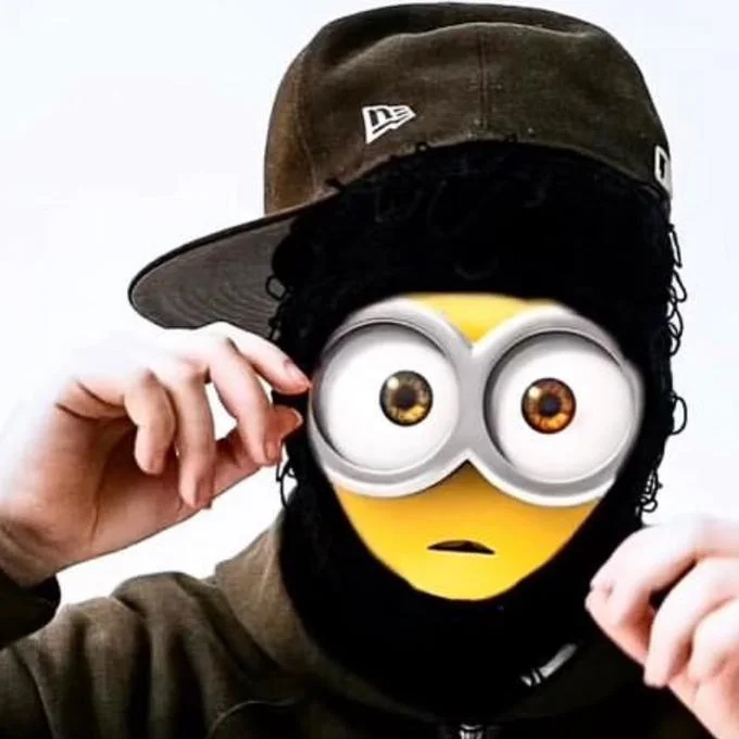 "Rich Minion" by Yeat — Close-up of Yeat with Minion goggles and yellow face edited over his features