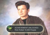 Rickroll — A video game achievement unlocked graphic showing Rick Astley's face with achievement text playing on meme's cultural pervasiveness.