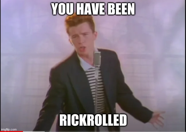 A classic image macro showing Rick Astley in his signature suit with bold white impact font text reading 'YOU HAVE BEEN RICKROLLED.'