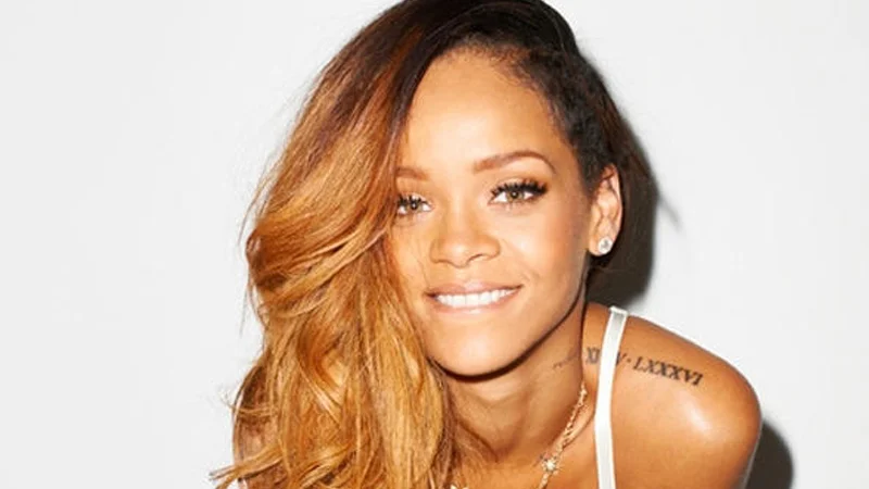 Close-up portrait of Rihanna smiling with ombré hair