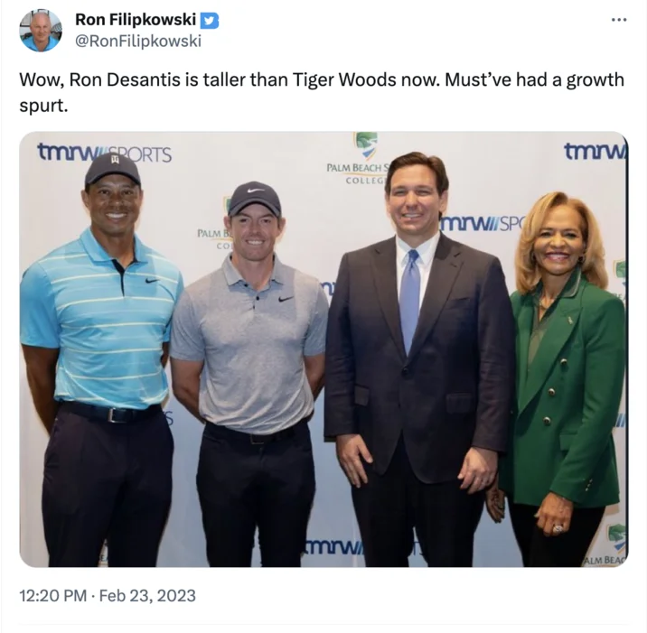 Ron DeSantis High Heels Conspiracy Theory — Tweet joking about Ron DeSantis appearing taller than Tiger Woods in a group photo