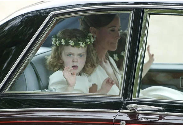 Royal Wedding Girl — Flower girl in flower crown waving from a car window at the royal wedding.