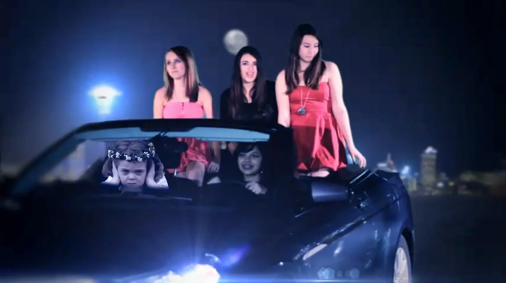 Royal Wedding Girl — Teen girls standing in a convertible at night with the ear-covering flower girl inserted in the car window.