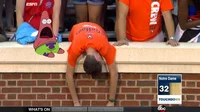 Sad Virginia Fan slumped over stadium wall while another UVA supporter behind screams with mouth wide open in disbelief with Notre Dame 32 score.