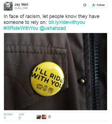 #SafetyPin — Tweet by Jay Wall featuring a yellow I'll Ride With You button pinned to a jacket