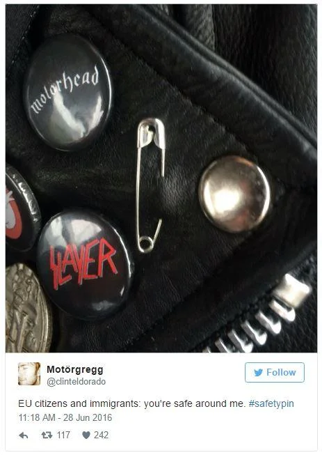 #SafetyPin — Safety pin on a metal fan's leather jacket next to Motörhead and Slayer buttons