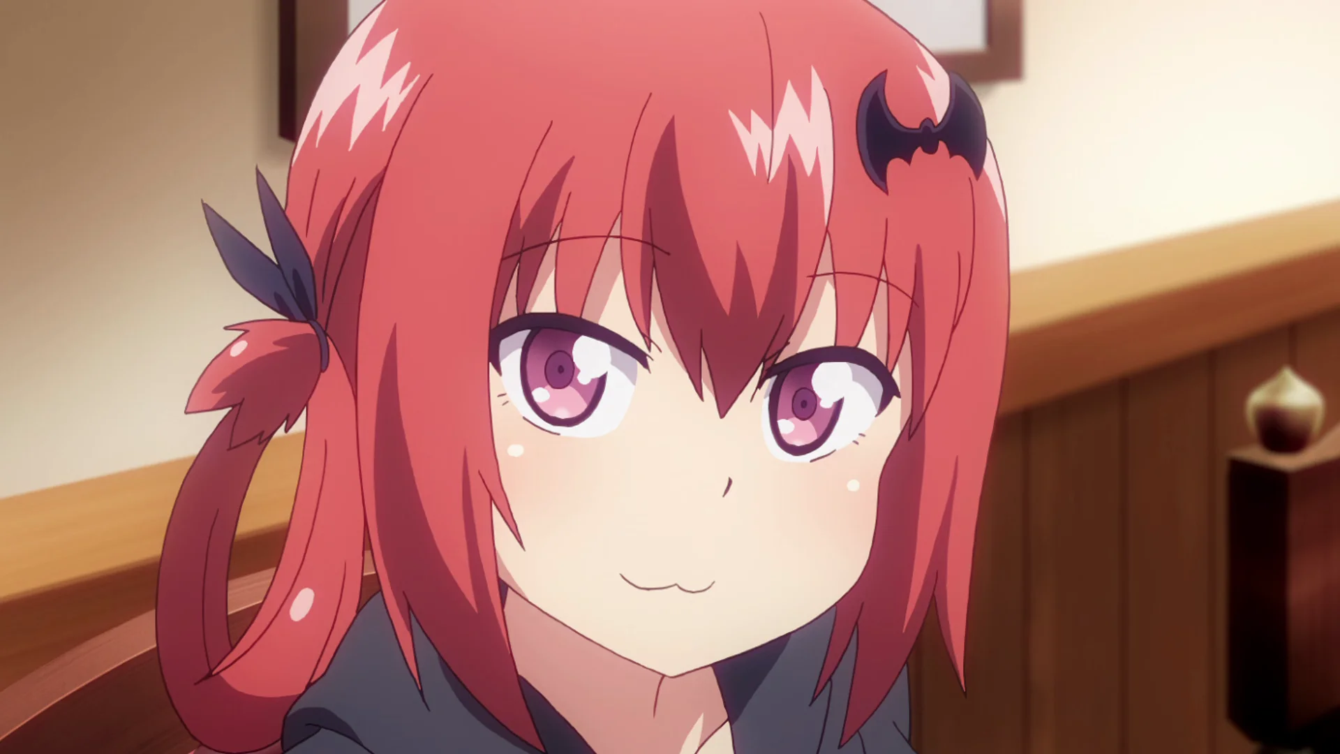 Close-up of Satania smiling smugly with red hair and purple eyes