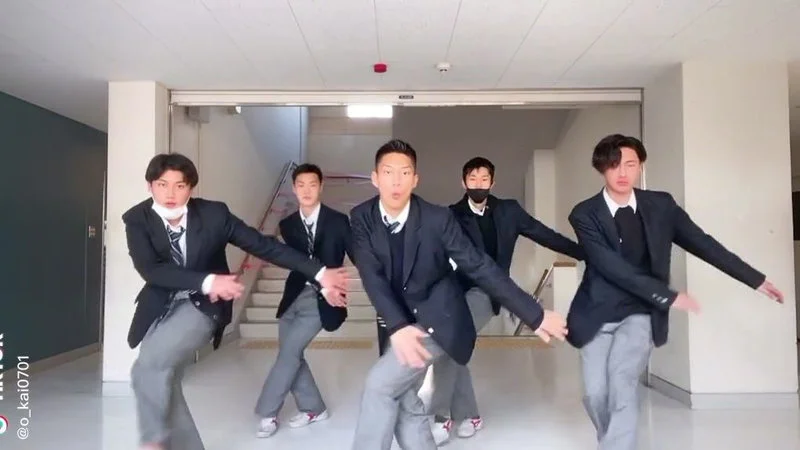 Scarlet Police On Ghetto Patrol 24Pm Dance — Five young men in dark suits and ties perform synchronized dance routine in hallway in coordinated low stance with