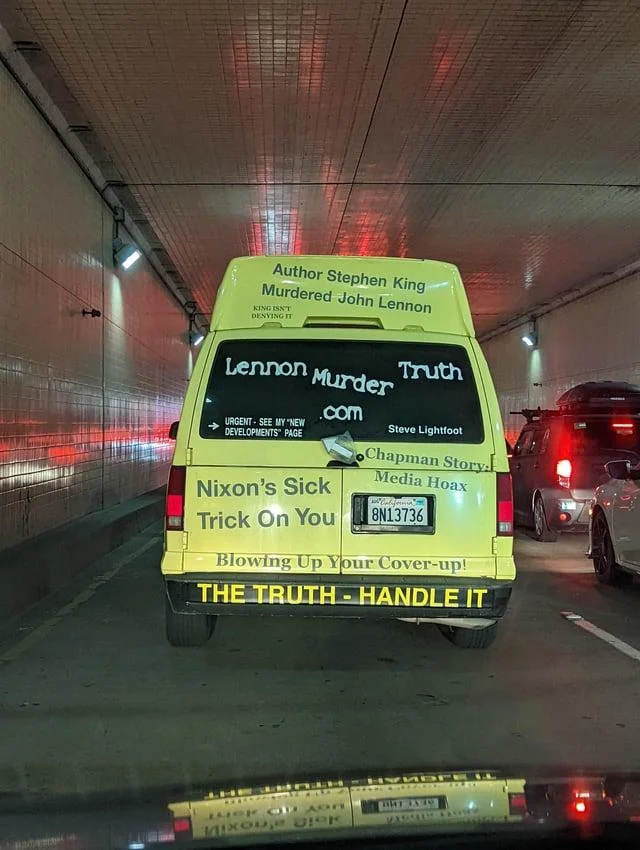 Schizophrenia Rides Schizo Whips — Yellow van in tunnel painted with claims that Stephen King murdered John Lennon