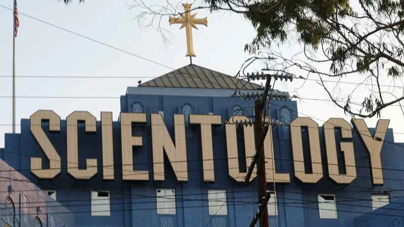 Church of Scientology building with large Scientology sign and cross on top