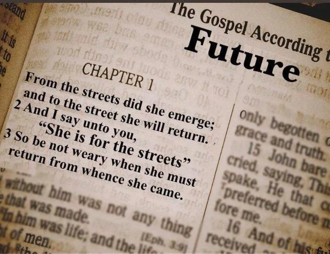 She Belongs To The Streets — Close-up of a Bible page edited to read a fake Gospel of Future passage declaring 'She is for the streets'.