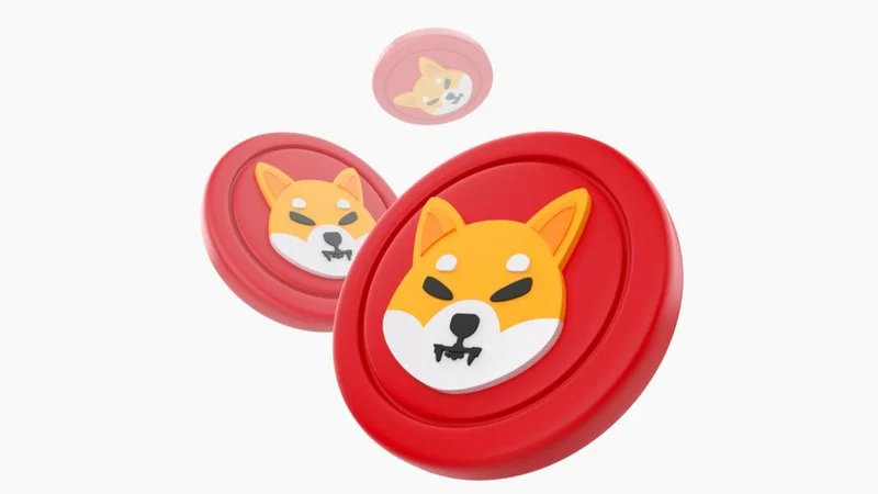 Shiba Inus — Three red 3D-rendered coins featuring a cartoon Shiba Inu face