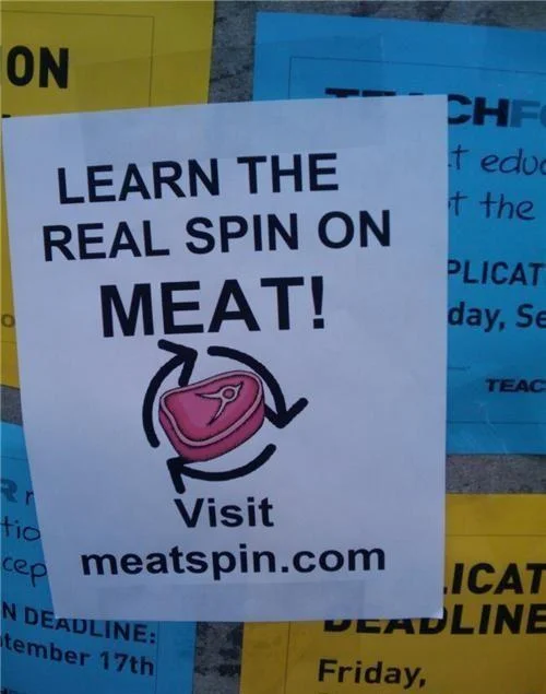 Shock Sites — Flyer on a bulletin board reading 'Learn the real spin on meat! Visit meatspin.com.'