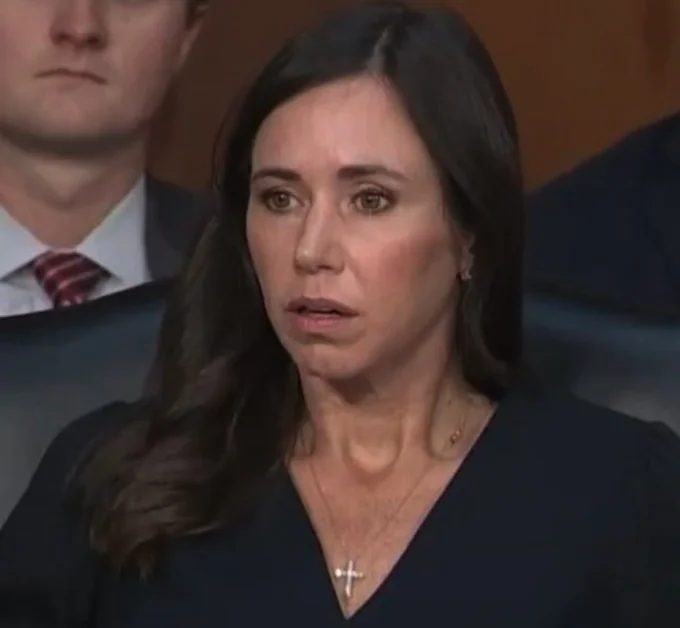 Shocked Katie Britt — Close-up portrait of Senator Katie Britt frozen in a shocked, open-mouthed stare during a Senate hearing.