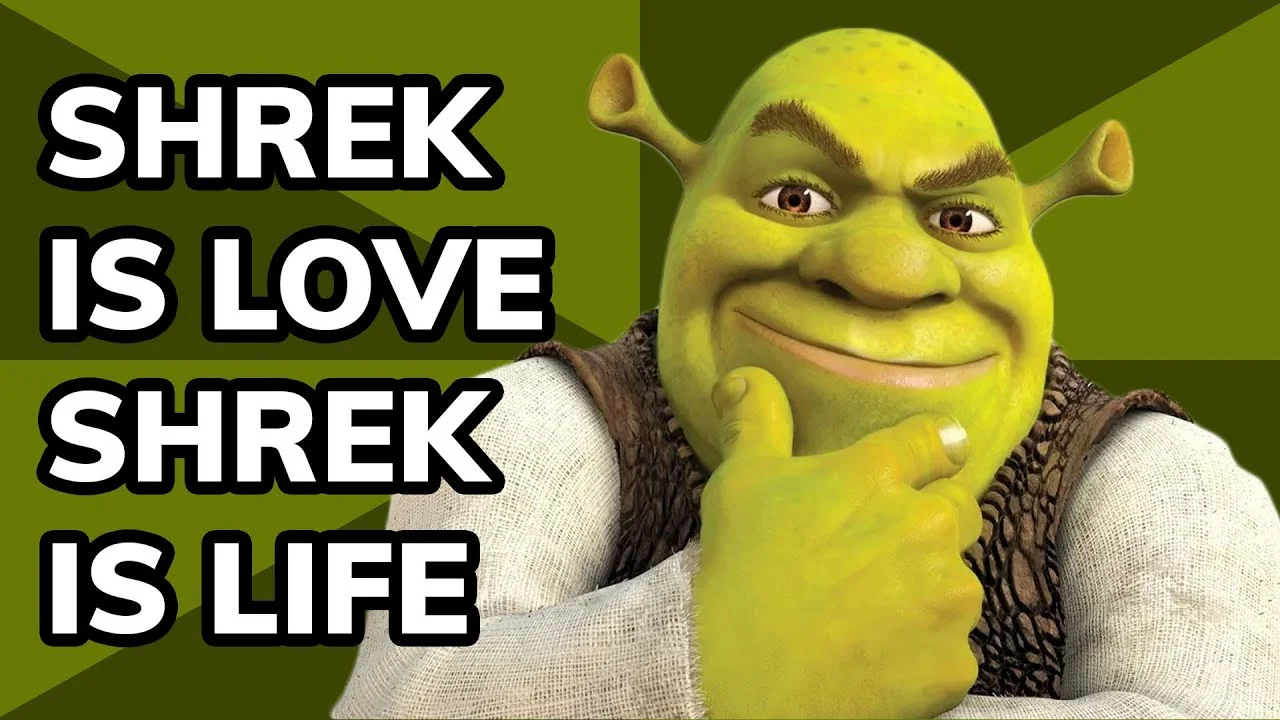 Shrek smiles confidently against a green background with bold white text reading 'SHREK IS LOVE SHREK IS LIFE'.