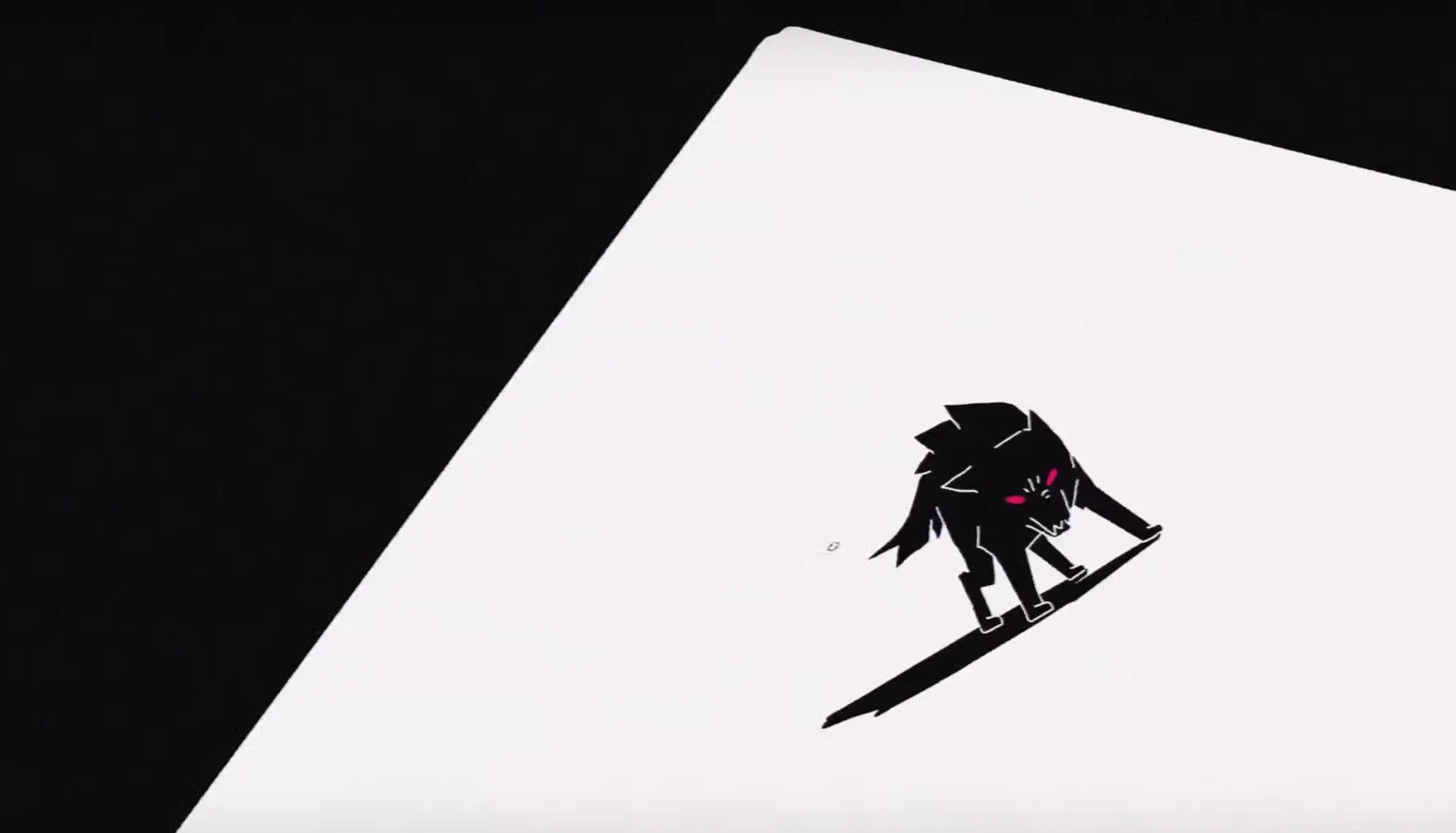 Siamés' "The Wolf" — Black wolf with glowing pink eyes on a white paper in the Siames 'The Wolf' music video.