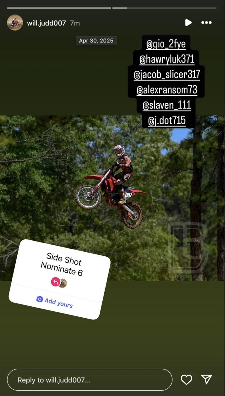A motocross athlete performing a jump or maneuver in action sharing to the Side Shot Nominate 6 trend with sticker and nominations.