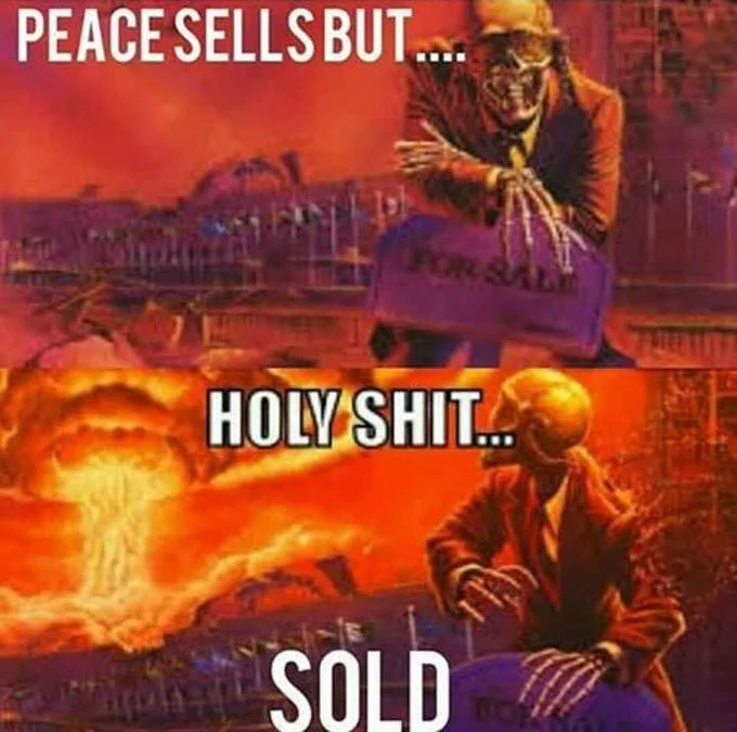 Skeleton Looking at Explosion — Two-panel meme reading Peace Sells But... Holy Shit... Sold with Vic Rattlehead artwork