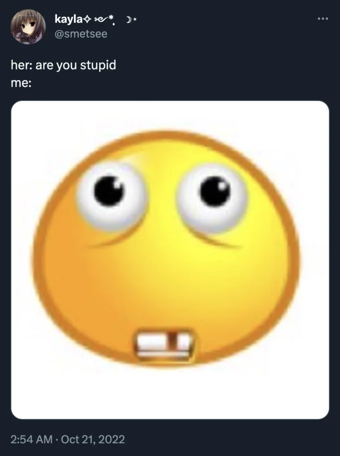 Smiling Buck Tooth Emoji — Tweet with caption 'her: are you stupid / me:' above a worried buck-tooth emoji image