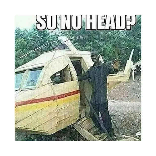Meme labeled 'SO NO HEAD?' with a man beside a homemade wooden aircraft with no cockpit head in the jungle.