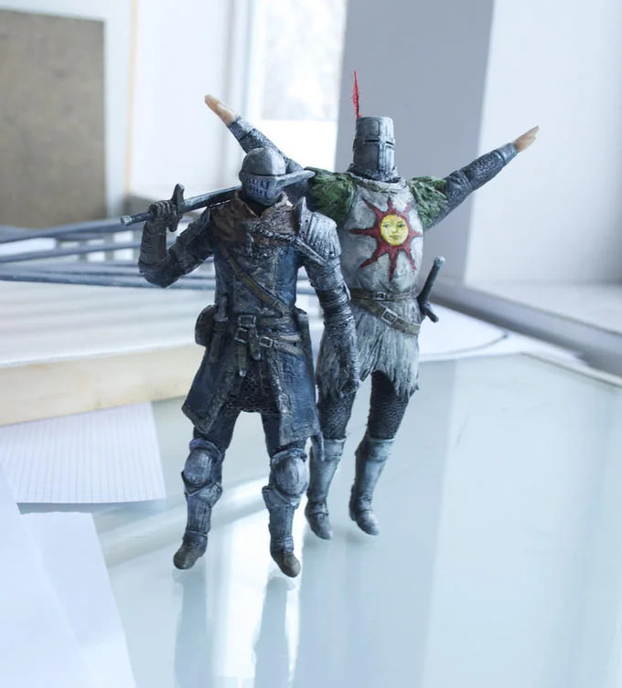 Solaire Of Astora — Detailed action figure of Solaire in iconic pose with arms extended and sun symbol medallion visible.