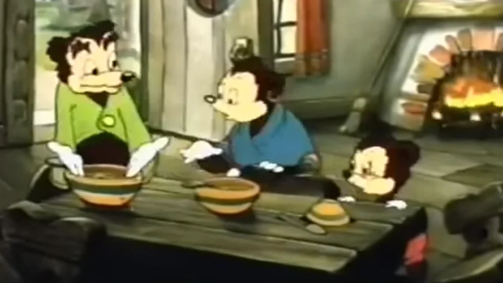 Somebody Toucha My Spaghet — Cartoon mouse family sitting at a wooden dinner table with soup bowls in a rustic cabin, fireplace glowing in the background.