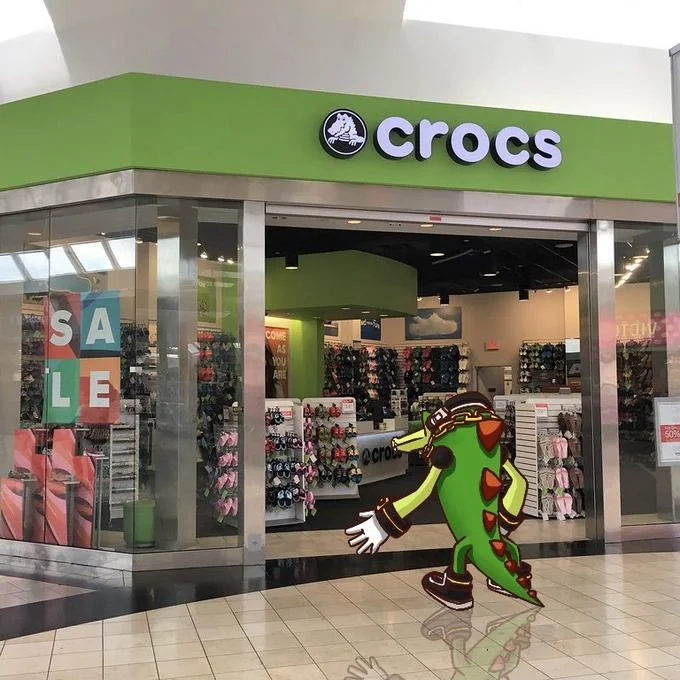 Sonic Characters Walking Into Stores — Vector the Crocodile at Crocs shoe store entrance with green storefront.