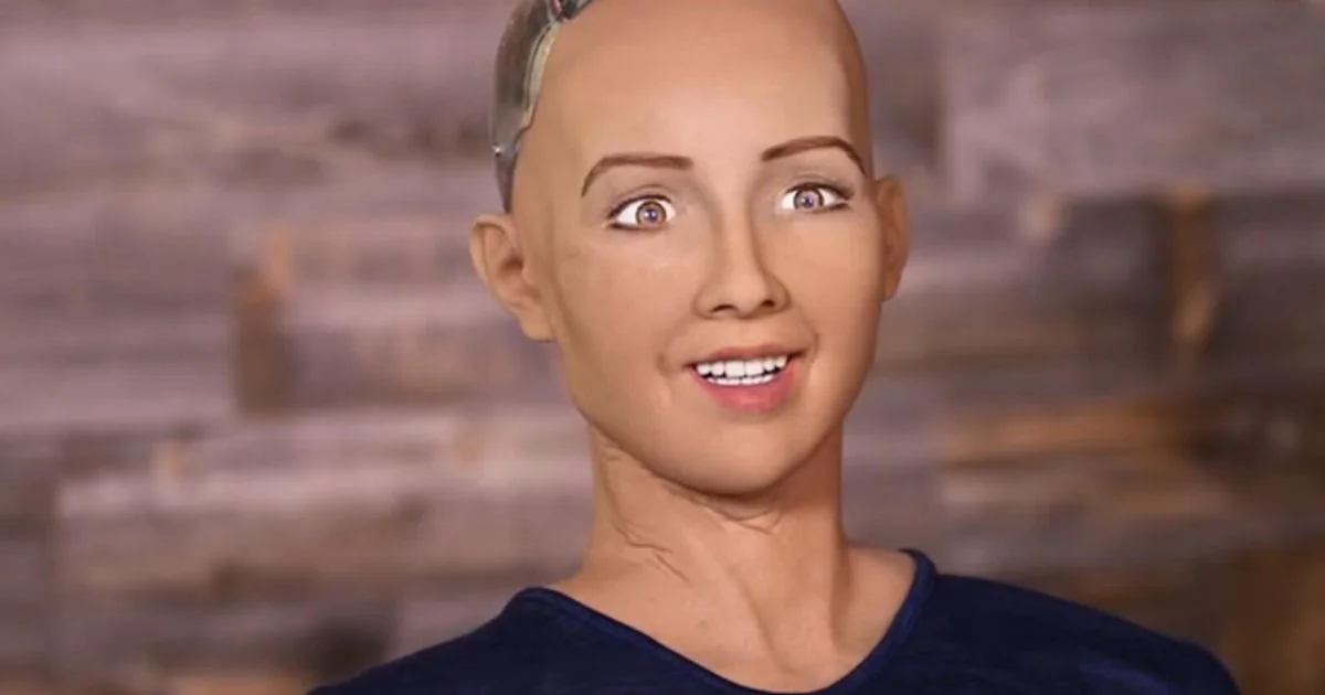 Sophia the Robot — Close-up of Sophia the humanoid robot smiling with a translucent head revealing mechanical parts
