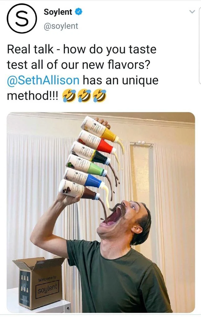 Tweet from @soylent showing man with open mouth being poured six flavors from stacked Soylent bottles