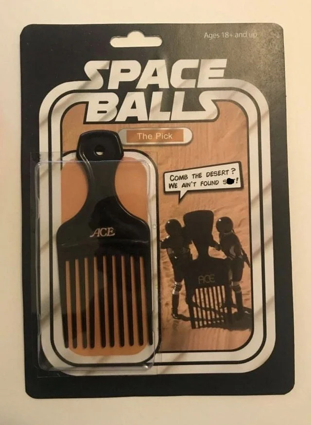 Parody Spaceballs action figure packaging containing an afro pick with a 'Comb the desert' caption.