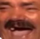 Spanish Laughing Guy — Tightly cropped close-up of wide-mouthed laughing expression with minimal background framing.
