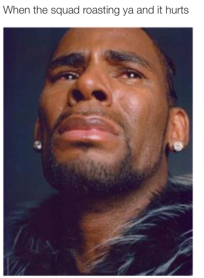 Close-up portrait of man with emotional facial expression, captioned 'When squad roasting ya and it hurts.'