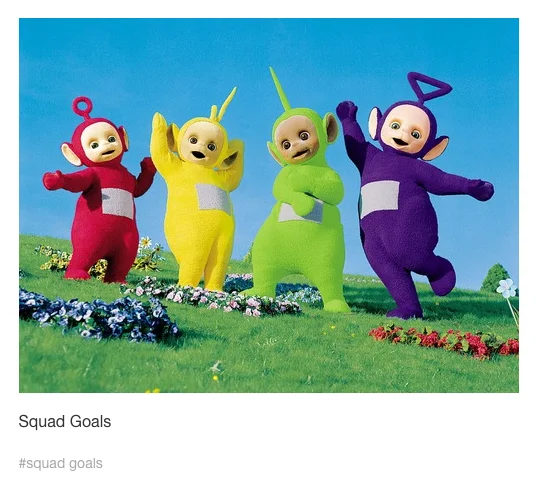Four Teletubbies in vibrant colored suits standing on grass in bright outdoor setting, captioned 'Squad Goals.'